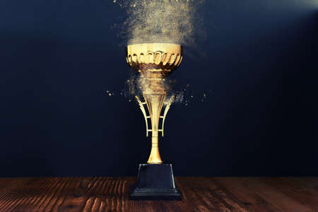 image of gold trophy over dark backgroundの写真素材