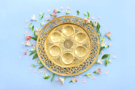 Pesah celebration concept (jewish Passover holiday). Translation of Traditional pesakh plate text: Passove, horseradish, celery, egg, bone, bitter hearb, sweet dateの写真素材