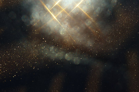 background of abstract glitter lights. gold and black. de focused