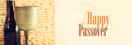 Passover background. Old Wine cup and matzoh (jewish holiday bread)の写真素材