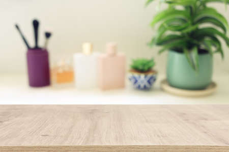 empty table board and defocused vintage woman toilet desk background. product display concept