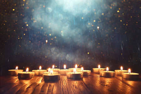 Burning candle over black backgroundの写真素材