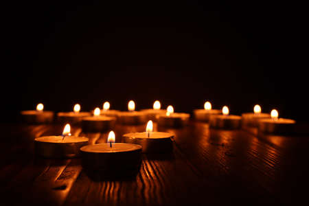 Burning candle over black backgroundの写真素材