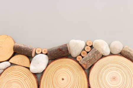 Wooden logs over gray background, eco and spa conceptの写真素材