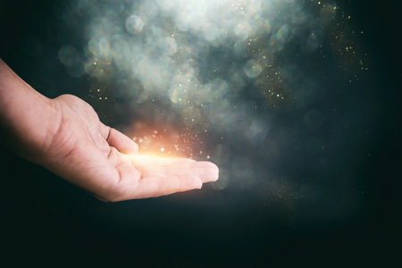 Human hand and magical glowing lightの写真素材