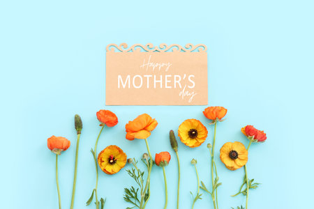 mother's day concept with pink flowers over pastel background