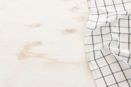 top view of vintage tablecloth with over white wooden backgroundの写真素材