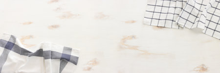 top view of vintage tablecloth with over white wooden background