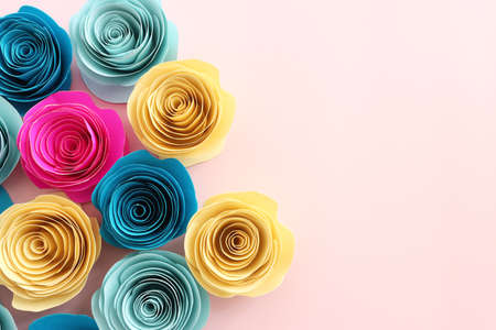 Top view image of colorful paper flowers composition over pastel pink backgroundの写真素材
