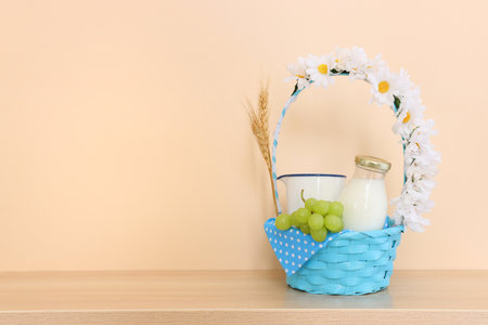 Photo of dairy products over wooden table. Symbols of jewish holiday - Shavuotの写真素材