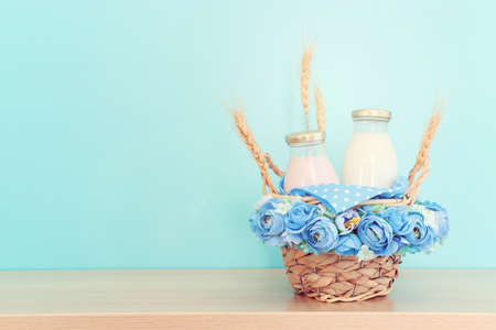 Photo of dairy products over wooden table. Symbols of jewish holiday - Shavuotの写真素材