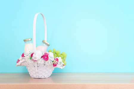 Photo of dairy products over wooden table. Symbols of jewish holiday - Shavuot