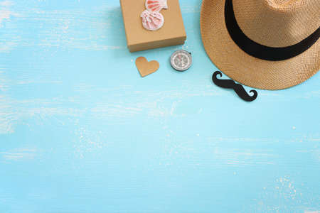 Father's day and travel concept over blue wooden background. top view, flat layの写真素材