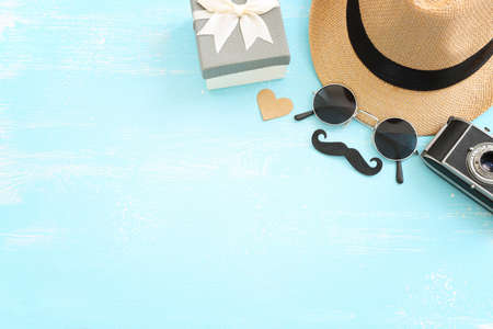 Father's day and travel concept over blue wooden background. top view, flat layの写真素材