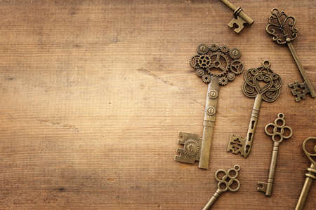 Top view image of old keys over wooden backgroundの写真素材
