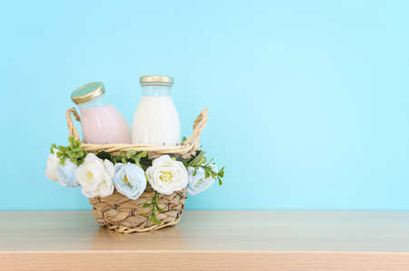 Photo of dairy products over wooden table. Symbols of jewish holiday - Shavuot
