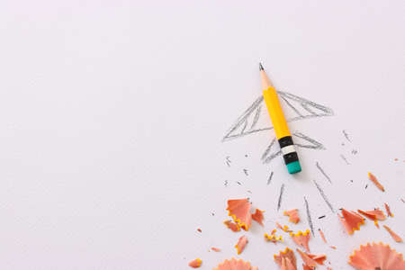 Pencil and rocket sketch over textured paper, concept of back to school, creativity and successの写真素材