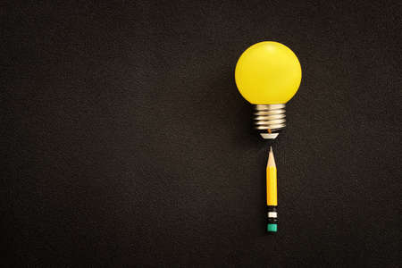 Education concept image. Creative idea and innovation. light bulb metaphor over black backgroundの写真素材