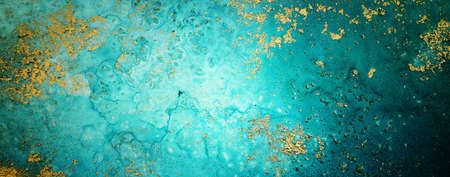 art photography of abstract fluid painting with alcohol ink, blue and gold colorsの写真素材