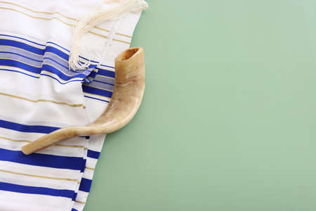 religion image of shofar (horn) on white prayer talit. Rosh hashanah (jewish New Year holiday),...