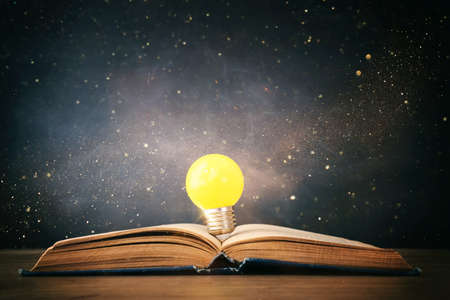 Education concept image. Creative idea and innovation. light bulb metaphor over blackboard backgroundの写真素材
