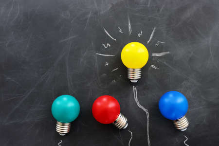 Education concept image. Creative idea and innovation. light bulb metaphor over blackboard backgroundの写真素材