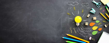 Education concept image. Creative idea and innovation. light bulb metaphor over blackboard...