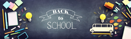 education. Back to school concept over wooden table and blackboard background