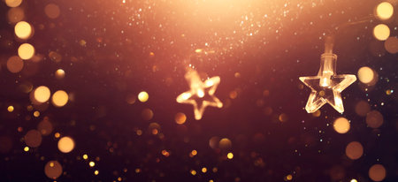 Christmas warm gold garland lights over dark background with glitter overlay