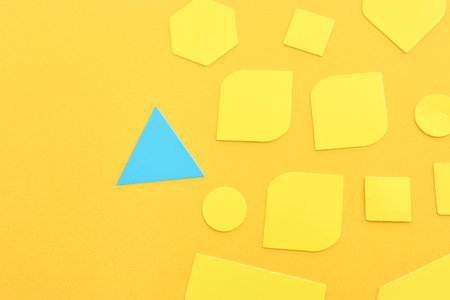 Concept of unique thinking. Paper shapes of the same color versus a different oneの写真素材