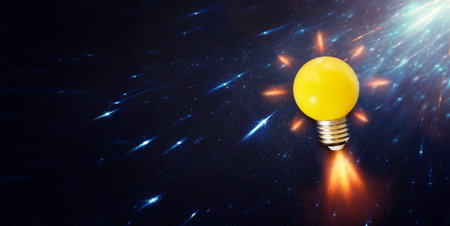 Light bulb over dark black background. Concept of creativity and innovationの写真素材