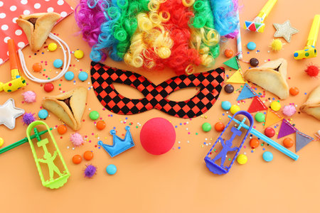 Purim celebration concept (jewish carnival holiday) over yellow background. Top view, flat layの写真素材