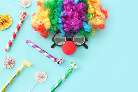 carnival, party and Purim celebration concept (jewish carnival holiday) over blue backgroundの写真素材