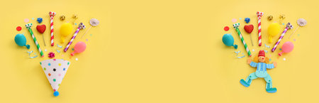Top view image of party and present objects on yellow background