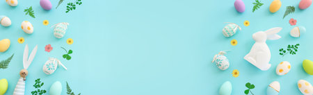 Cute bunny next to easter colorful eggs over blue pastel background