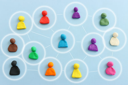 Colorful figures connected over blue background, concept of human resources and collaboration