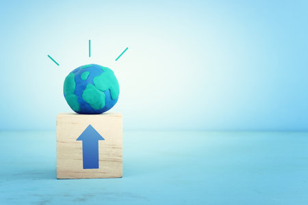 Globe model on wooden table and blue backgroundの写真素材