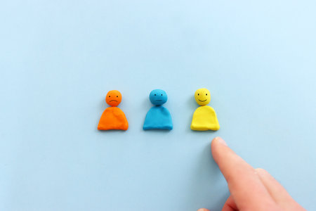 Top view image of figures with happy and sad face. concept of happiness emotion and satisfactionの写真素材