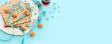 Pesah celebration concept (jewish Passover holiday) over pastel blue backgroundの写真素材