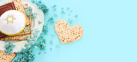 Pesah celebration concept (jewish Passover holiday) over pastel blue backgroundの写真素材