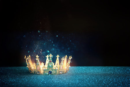 low key image of beautiful queen or king crown over glitter table. fantasy medieval periodの写真素材