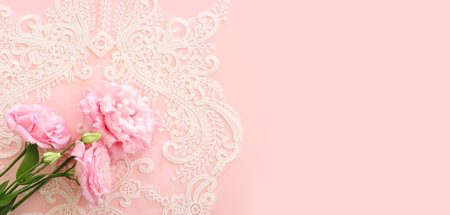 Top view image of delicate flower over pastel backgroundの写真素材