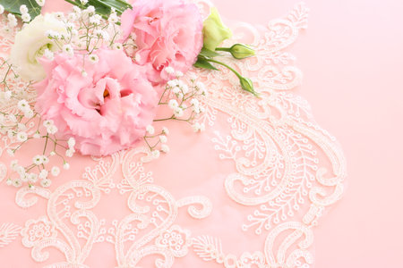Close up image of delicate pink flowers over pastel backgroundの写真素材