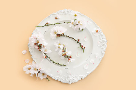 Top view of vintage white empty plate over spring cherry tree flowers. Flat layの写真素材