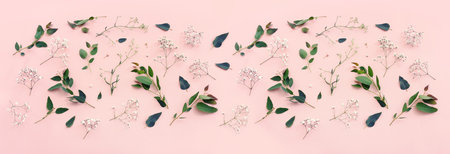 Top view image of flowers composition over pink pastel backgroundの写真素材