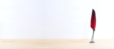 vintage ink pen with red featherの写真素材