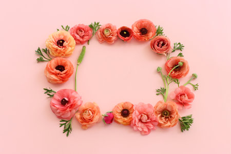 Top view image of pink flowers composition over pastel backgroundの写真素材