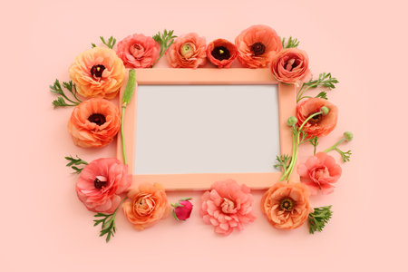 top view of pink flowers and wooden empty frame over pastel background. For mock up, copy spaceの写真素材