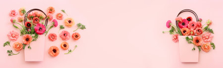 Top view image of pink flowers composition over pastel backgroundの写真素材