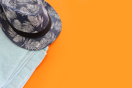 Tropical vacation and summer travel image with hat and towel. Top viewの写真素材